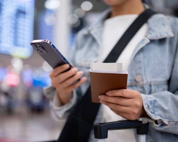traveler at airport with passport